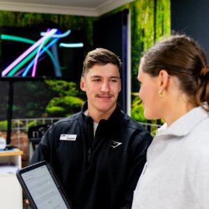 Podiatrist discussing a tailored treatment plan with a patient in Toowoomba